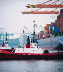 container-ship-and-tugboats-in-harbor-tacoma-was-2023-11-27-05-26-09-utc-min-2048x1363-1.webp